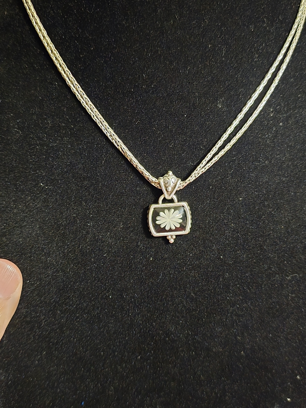 Reversible two-tone floral pendant necklace from Brighton